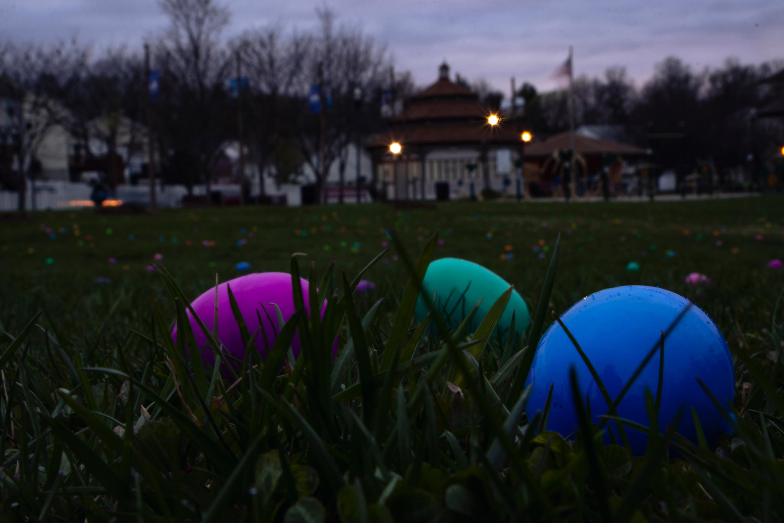 plastic eggs in a field at dusk